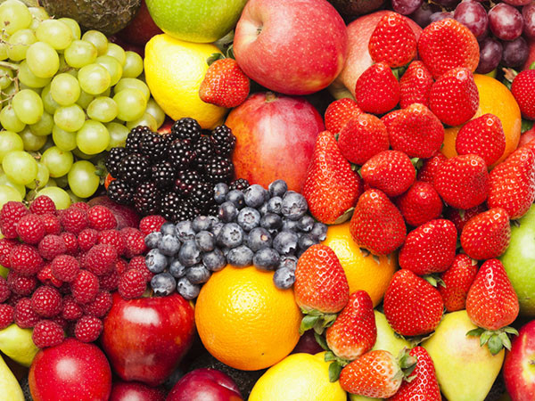 close up image of a colorful variety of assorted fruits